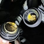 Menjava olja, rumen madež pod pokrovom